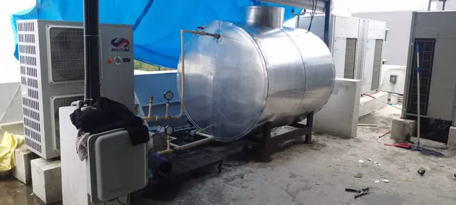 Redstone heat pump beside an insulated tank under a rooftop canopy