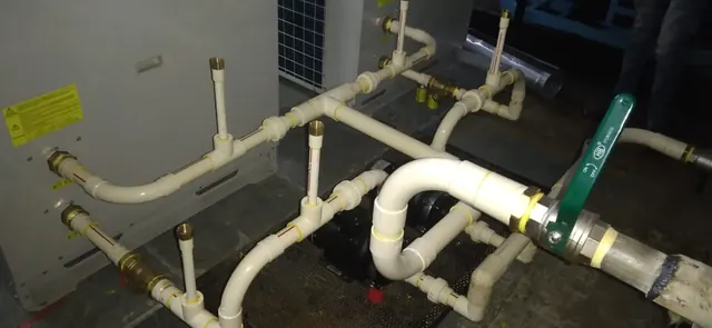 Heat pump water connections with valves and pipework