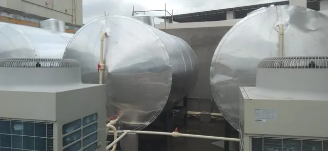 Insulated hot water tanks paired with heat pump units