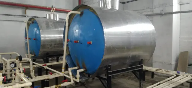 Two hot water storage tanks with valve manifolds